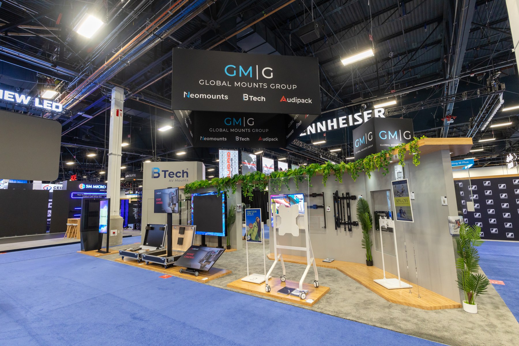 GKC exhibition stand with overhead signage and white seating