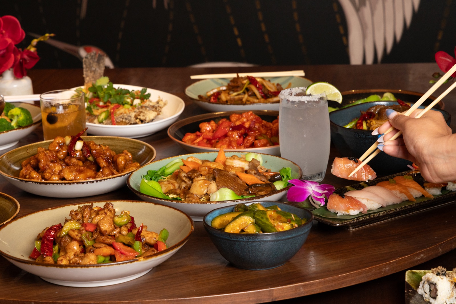Noodle Den dining spread with sushi, dishes and cocktails at SAHARA Las Vegas